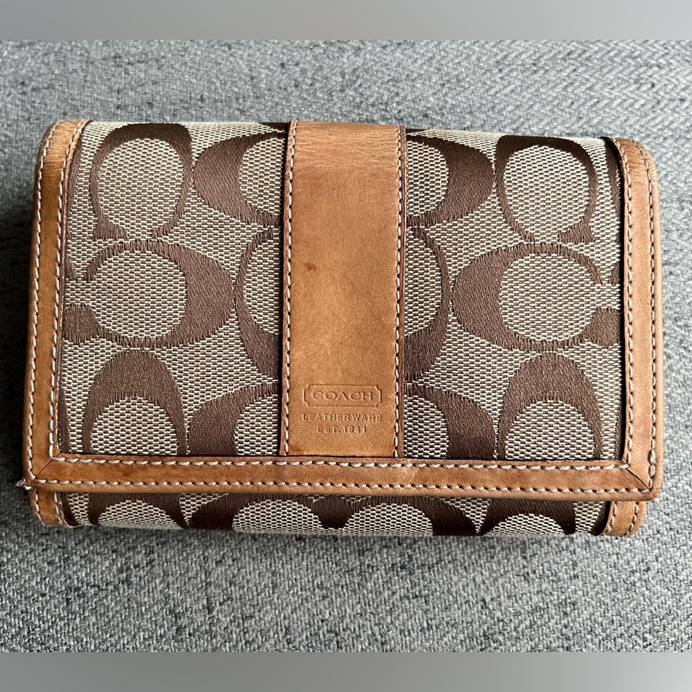 Coach Tan signature monogram compact wallet.